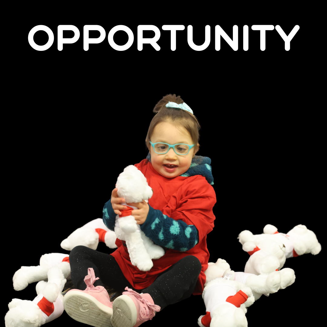 Little girl sitting with teddy bears with the word OPPORTUNITY