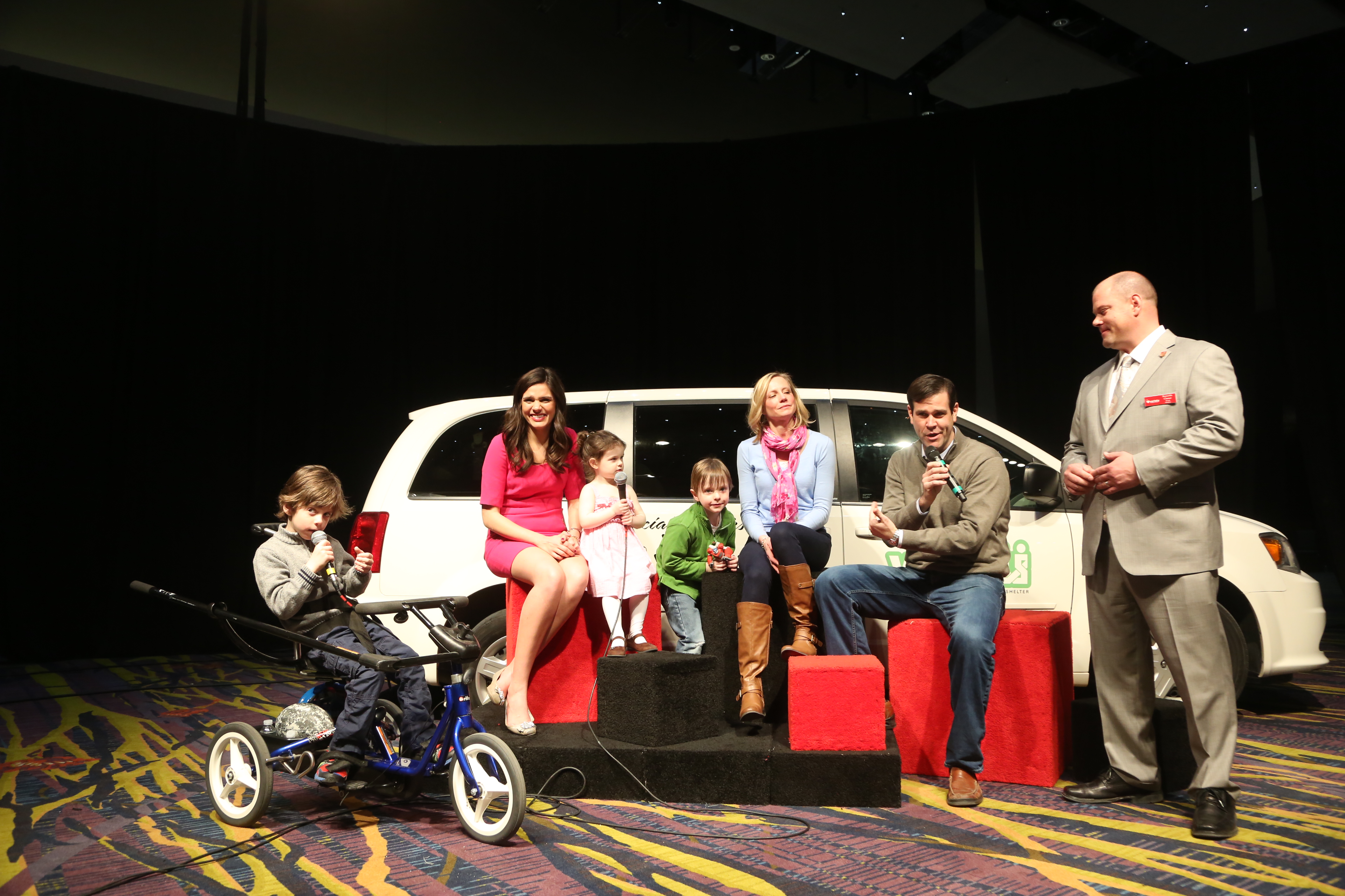 child with special needs being awarded an adaptive bike