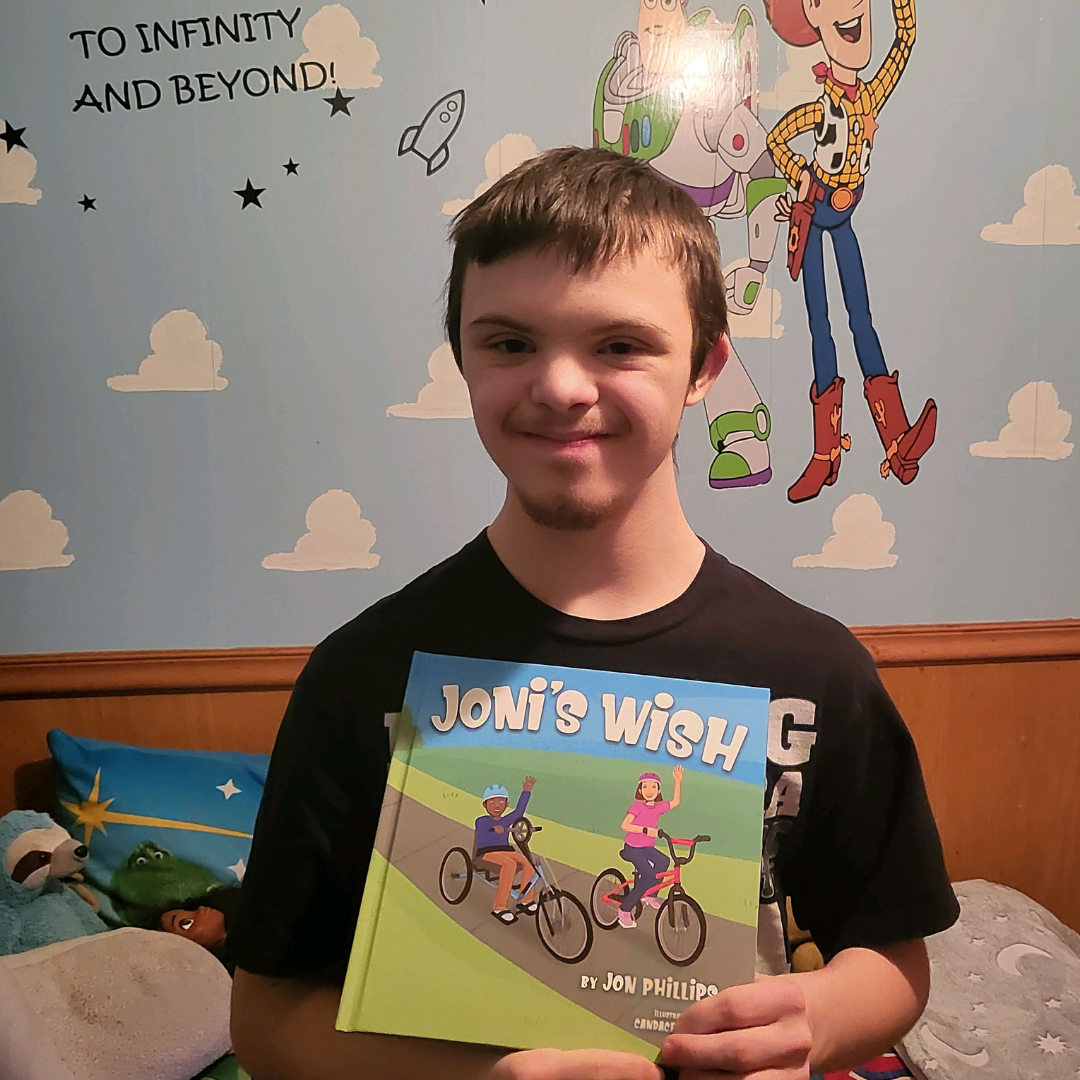 Lucas and his copy of Joni's Wish